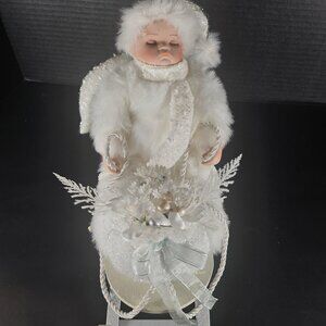 All White Heritage Signature Collection Porcelain Baby Doll in Winter Sleigh